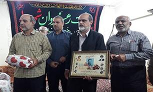 خانواده شهید«غلامرضا باوی» در پایتخت دفاع مقدس تجلیل شدند
